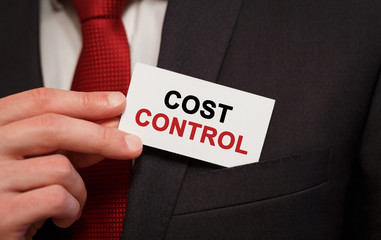 Poster - businessman putting a card with text cost control in the pocket