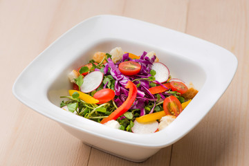 Wall Mural - Homemade fresh green vegetable salad on table.