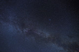 Fototapeta Kosmos - Starry night sky with the Milky Way. Astrophotography of the open space.