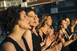 © karrastock - Group of persons in the street happy