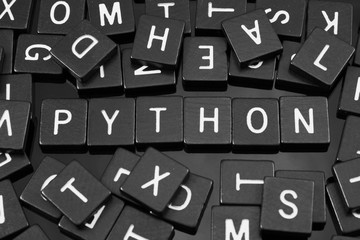 black letter tiles spelling the word 