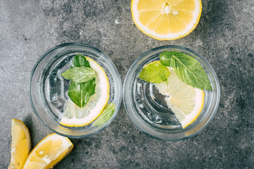 Wall Mural - Glass of water on stone background