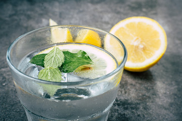 Wall Mural - Glass of water on stone background