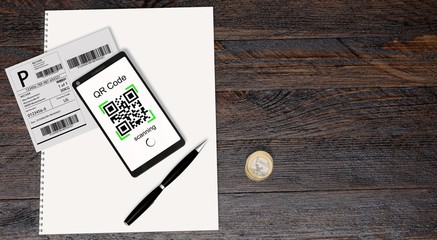 Wall Mural - QR Code scanning from a shipping stickers with modern touchscreen smartphone 