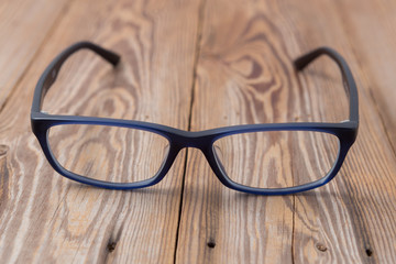 glasses on wooden background