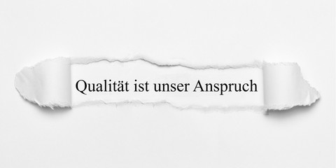 Poster - Qualität ist unser Anspruch auf weißen Papier