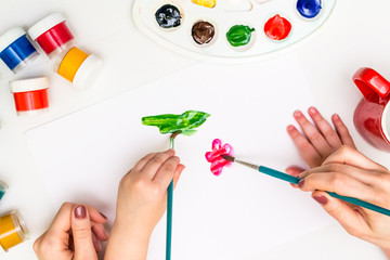 Wall Mural - Child painting a flower