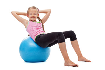young girl doing abdominal gymnastic exercises