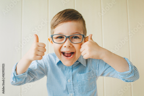 A Child With Glasses Gives A Thumbs Up A Kid Likes The Glasses