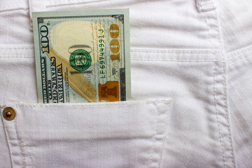 Wall Mural - dollar banknotes in jeans pocket closeup. Business concept. pocket money.