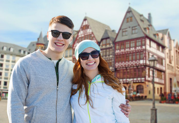 Wall Mural - happy teenage couple over frankfurt am main city