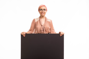 Young happy woman portrait of a confident businesswoman showing presentation, pointing placard background. Ideal for banners, registration forms, presentation, landings, presenting concept.