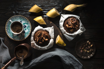 Wall Mural - Banana cupcakes and coffee on the wooden table horizontal