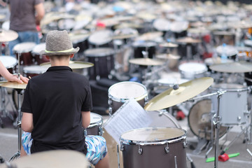 Wall Mural - A young musician behind a drum set. Baltic Drum Summit 2017. Riga, Latvia.