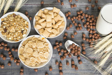 Various Cold Cereals On The Dark Wooden Background.