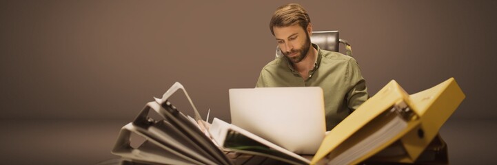 Fototapete - Man working with loads of files and folders pile
