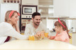© ivanko80 - Happy family having breakfast in kitchen