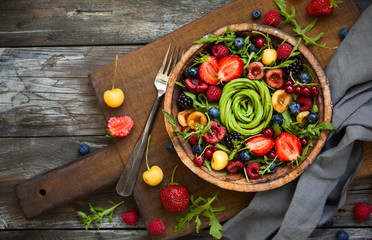 Wall Mural - Fresh salad with fruit,berry and vegetables.