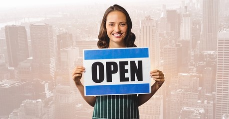 Poster - Shop owner with open sign against blurry skyline
