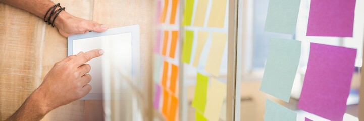Poster - Overhead of hands with tablet and sticky note transition