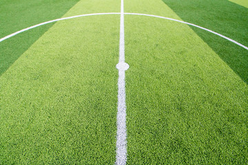 Wall Mural - The white Line marking on the artificial green grass soccer field