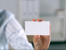 Close-up Of Business Card In Women Hand