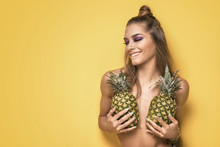 Young Crazy Girl With Pineapples.