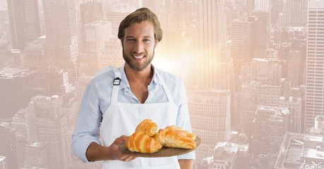 Poster - Restaurant owner with croissants against blurry skyline
