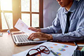 Businessman analyzing investment charts