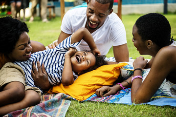 Black family enjoying summer together at backyard