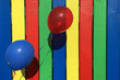 © Rafael Ben-Ari - Blue and red balloon on a colourful fence