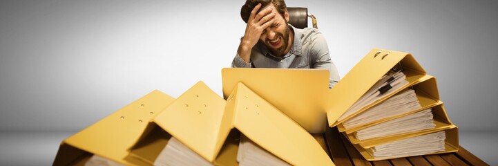 Fototapete - Stressed and tired man with lots of files table
