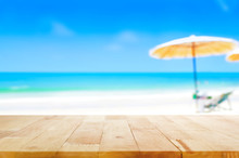 Wood Table Top On Blurred Blue Sea And White Sand Beach Background
