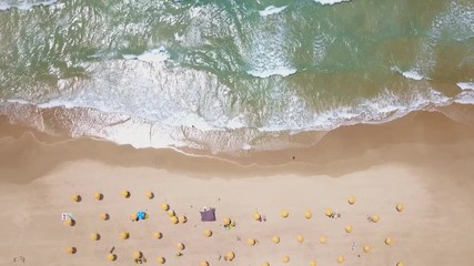 Wall Mural - Tropical beach with colorful umbrellas - Top down aerial view