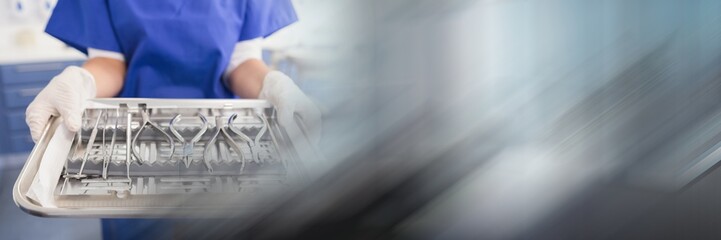 Canvas Print - Close up of dentist with tray and blurry grey transition