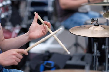 Wall Mural - The drummer's hands with chopsticks behind the drum set. Baltic Drum Summit 2017. Riga, Latvia.