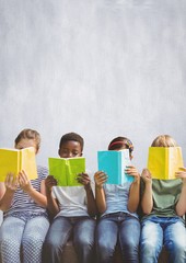 Wall Mural - Group of children reading books in front of bright background