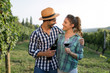 © NDABCREATIVITY - Romantic couple in vineyard before harvesting