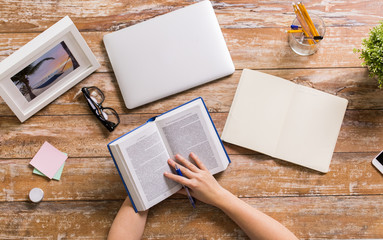 Sticker - hands of woman reading book at wooden table