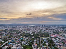 Top View From Drone Camera : Sunset Time On City Scape, 
Beautiful City At Twilight Sky Clouds, Khonkaen Thailand.