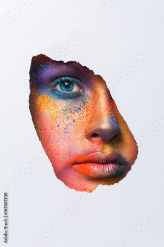 Face of model with colorful art make-up, close-up