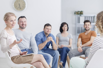 Wall Mural - Group listening to the woman