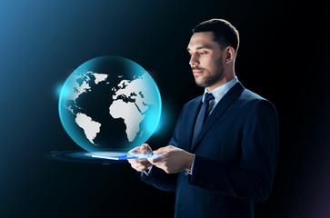 Canvas Print - businessman with tablet pc and earth projection