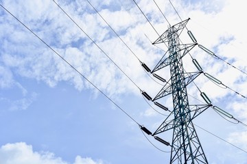 High-Voltage Power Lines Against the Blue Sky