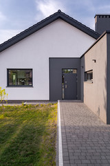 Wall Mural - House with cobblestone entry pathway