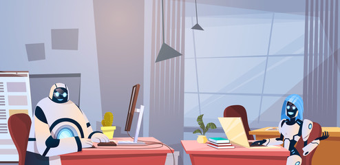 Poster - Modern Robots Working In Office Sitting At Desk Artificial Intelligence Technology Concept Flat Vector Illustration