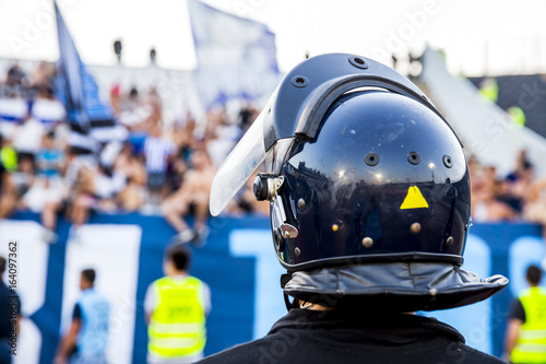 Valokuva policeman with helmet guarding a sport event