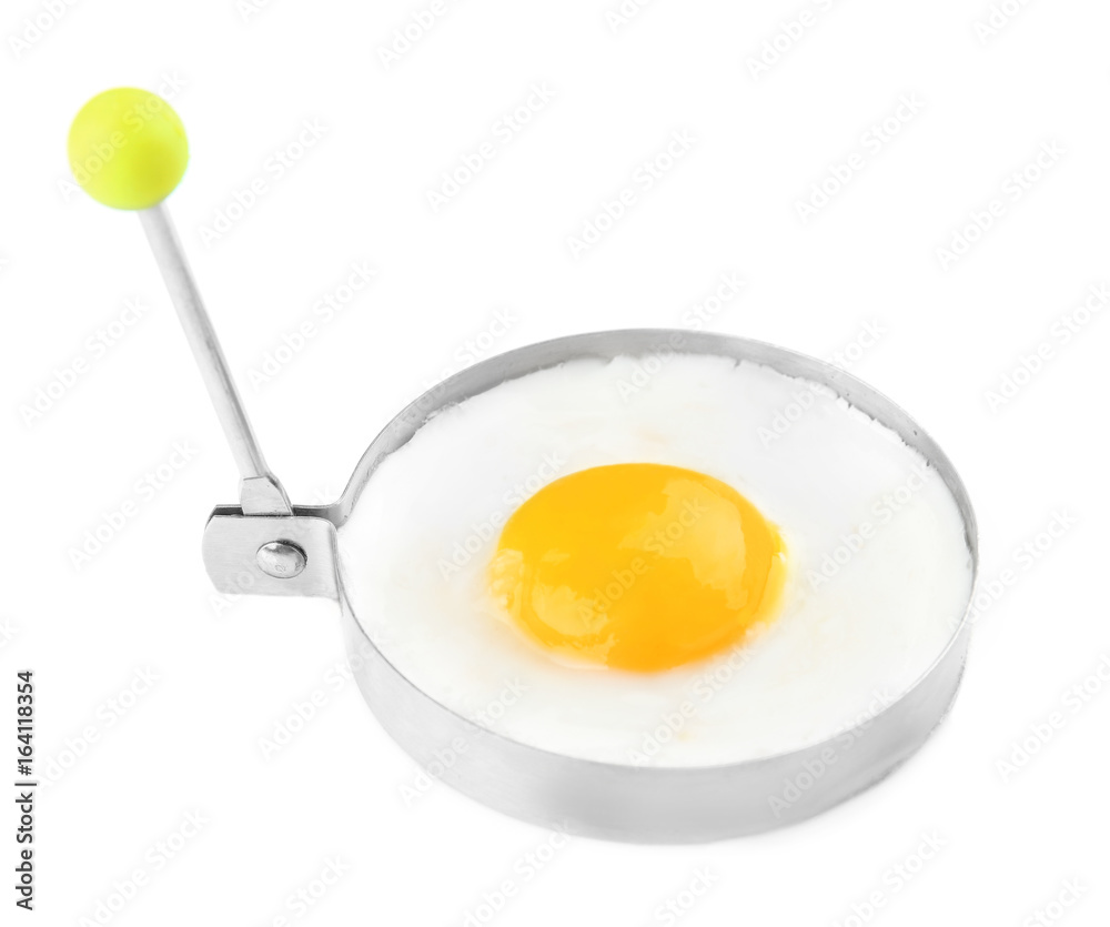 Fried sunny side up egg in round mold isolated on white