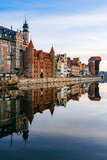 Fototapeta  - Embankment of Motlawa river with reflection on water, Gdansk