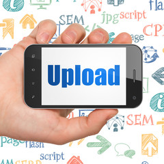 Web development concept: Hand Holding Smartphone with Upload on display